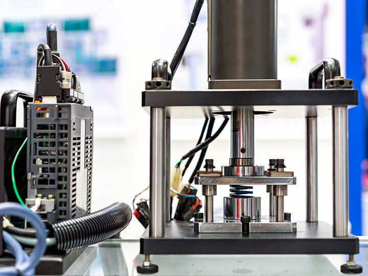 Hydraulic press machine and controller during metal spring test for durability, endurance, fatigue, pressure, force, and more