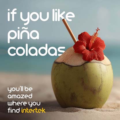 Pineapple sitting on the beach with straw sticking out of it